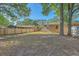 Spacious backyard with mature trees, providing ample shade and privacy for outdoor enjoyment at 100 Lipman St, Summerville, SC 29483