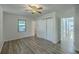 Spacious bedroom with hardwood floors, a ceiling fan, and a large window for natural light at 100 Lipman St, Summerville, SC 29483