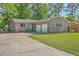 Charming brick home with a well-maintained lawn and a two-car garage at 100 Lipman St, Summerville, SC 29483