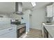 Bright kitchen with stainless steel appliances, a modern range hood, and sleek countertops at 100 Lipman St, Summerville, SC 29483