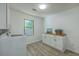 Functional laundry room with modern washer and dryer and a butcher block countertop at 100 Lipman St, Summerville, SC 29483