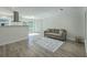 Cozy living area with hardwood floors, an area rug, and sliding doors to the patio at 100 Lipman St, Summerville, SC 29483