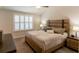 Comfortable bedroom with neutral tones, large window, and a unique headboard design at 10032 Randall, McClellanville, SC 29458