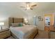 Spacious bedroom featuring neutral decor, large windows, and access to an ensuite bathroom at 10032 Randall, McClellanville, SC 29458