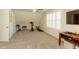 Spacious bonus room with an exercise bike and a TV at 10032 Randall, McClellanville, SC 29458