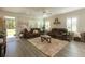 Inviting living room featuring a plush rug, neutral walls, and natural light at 10032 Randall, McClellanville, SC 29458