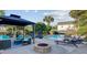 Backyard patio with a fire pit, cozy seating, and a view of the pool area at 101 Writing Ct, Ladson, SC 29456
