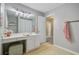 Beautiful bathroom featuring a vanity with lighting and a sink with pink towels hung nearby at 101 Writing Ct, Ladson, SC 29456