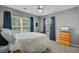 Bright bedroom features an abundance of natural light with hardwood furniture and accents at 101 Writing Ct, Ladson, SC 29456