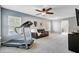 Bonus room features a TV, treadmill, and ample natural light at 101 Writing Ct, Ladson, SC 29456