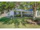 Charming home with a lush front yard, mature trees, and well-manicured landscaping at 101 Writing Ct, Ladson, SC 29456