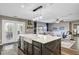 Kitchen with a center island, white countertops and access to the living room and outdoor patio at 101 Writing Ct, Ladson, SC 29456