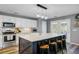 Open kitchen boasts a large island, white countertops, and stainless steel appliances at 101 Writing Ct, Ladson, SC 29456