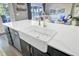 Farmhouse style kitchen sink with stainless steel appliances and a view into the living room at 101 Writing Ct, Ladson, SC 29456