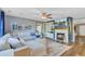 Comfortable living room with a large sectional sofa, fireplace with built ins, and an accent wall at 101 Writing Ct, Ladson, SC 29456