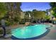 Backyard pool featuring a rock waterfall and sun loungers for a relaxing outdoor experience at 101 Writing Ct, Ladson, SC 29456