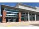 The exterior of a Performing Arts Center has architectural elements like brick accents and large windows at 1055 Tea Time Dr, Summerville, SC 29485