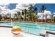 A sparkling community pool is adorned with colorful beach balls, inviting residents to relax and enjoy sunny days at 1055 Tea Time Dr, Summerville, SC 29485