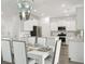 This open dining area offers stylish lighting and ample space for entertaining at 1055 Tea Time Dr, Summerville, SC 29485