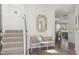 Charming entryway with hardwood floors, a mirror, bench seat, and stairway to the upper level at 1055 Tea Time Dr, Summerville, SC 29485