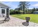 Inviting back patio with stylish furniture, paved flooring, and a view of the well-maintained yard at 106 Lakelyn Rd, Moncks Corner, SC 29461