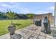 Spacious backyard featuring a paved patio, lush green grass, and an outdoor grill for entertaining at 106 Lakelyn Rd, Moncks Corner, SC 29461