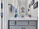 Bathroom featuring vanity with gray cabinets, countertop, and decorative mirror at 106 Lakelyn Rd, Moncks Corner, SC 29461