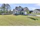 Beautiful two-story home with a well-maintained lawn and landscaping, offering great curb appeal at 106 Lakelyn Rd, Moncks Corner, SC 29461
