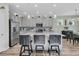 Kitchen showcases stainless appliances, gray cabinets, and an island with barstool seating at 106 Lakelyn Rd, Moncks Corner, SC 29461