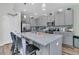 Kitchen featuring gray cabinets and stainless steel appliances, island, and hardwood floors at 106 Lakelyn Rd, Moncks Corner, SC 29461