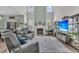 Bright and airy living room with high ceilings, a fireplace, and comfortable seating at 106 Lakelyn Rd, Moncks Corner, SC 29461