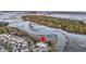 Stunning aerial shot with pin of a waterfront community surrounded by trees and waterways at 1063 Hills Plantation Dr, Charleston, SC 29412
