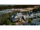 Stunning aerial view of a neighborhood showcases home, lush landscaping, and water views at 1063 Hills Plantation Dr, Charleston, SC 29412