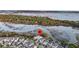 Breathtaking aerial view with pin showcases lush waterfront properties with tranquil waters at 1063 Hills Plantation Dr, Charleston, SC 29412