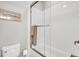 Bathroom with tiled shower and glass doors plus toilet and towel rack on the wall at 1063 Hills Plantation Dr, Charleston, SC 29412