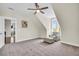 Spacious bedroom with a sitting area, neutral carpet, and plenty of natural light at 1063 Hills Plantation Dr, Charleston, SC 29412