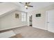 Bright bedroom with neutral carpet, ceiling fan, and an ensuite bathroom at 1063 Hills Plantation Dr, Charleston, SC 29412