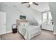 This well-lit bedroom features soothing colors, a ceiling fan, and plenty of storage space at 1063 Hills Plantation Dr, Charleston, SC 29412