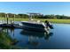 View of a boat situated on a lift in a tranquil waterway surrounded by lush greenery at 1063 Hills Plantation Dr, Charleston, SC 29412