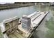Close up of a boat lift with a safe haven cabinet on a wooden dock at 1063 Hills Plantation Dr, Charleston, SC 29412