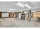 Spacious garage with concrete flooring, cinder block walls, and ample storage space at 1063 Hills Plantation Dr, Charleston, SC 29412