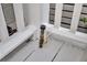 Close-up of a gas valve and hookup on a white porch at 1063 Hills Plantation Dr, Charleston, SC 29412