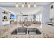 Kitchen sink with granite countertops and stainless faucet, viewing the living room at 1063 Hills Plantation Dr, Charleston, SC 29412
