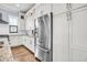 Bright kitchen features stainless steel appliances, granite counters, wooden floors and white cabinetry at 1063 Hills Plantation Dr, Charleston, SC 29412