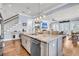 Open kitchen island features granite counters, stainless appliances, and views into the living room at 1063 Hills Plantation Dr, Charleston, SC 29412
