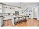 Spacious kitchen with a large island, granite countertops, white cabinets, and stainless steel appliances at 1063 Hills Plantation Dr, Charleston, SC 29412