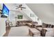 Cozy living room features a sectional sofa, plush armchair, and ceiling fan, perfect for relaxation at 1063 Hills Plantation Dr, Charleston, SC 29412