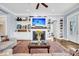 Inviting living room featuring a fireplace with built-in shelves and a stylish rug at 1063 Hills Plantation Dr, Charleston, SC 29412
