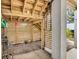 Outdoor shower area with slatted wood walls under a covered patio and concrete slab at 1063 Hills Plantation Dr, Charleston, SC 29412