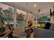 Relaxing screened porch with comfortable seating, ceiling fans, and beautiful water views at 1063 Hills Plantation Dr, Charleston, SC 29412